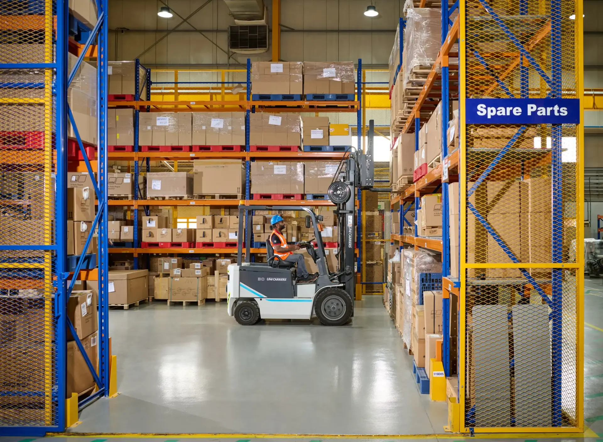 mtu and Volvo Penta spare parts warehouse with stocked shelves and forklift